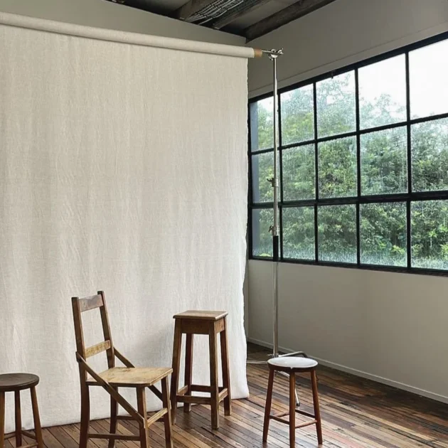 Photo of studio windows with linen and furniture